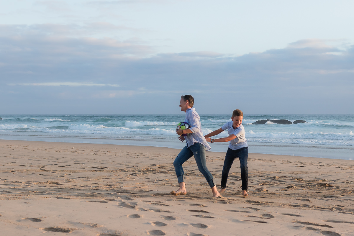 Mother and son on a beach at sunset in Sedgefield garden route during a photoshoot by moi du toi photography