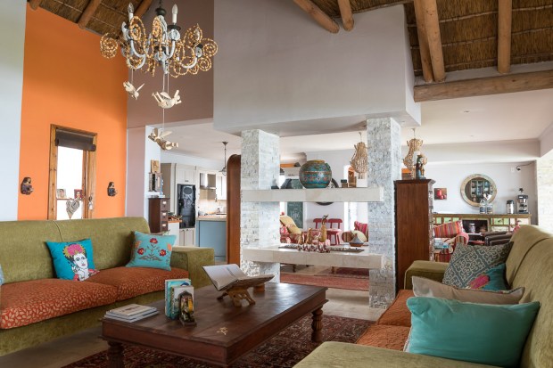 Stylish sitting room with colourful sofa and gfireplace at Cola Beach guest house sedgefield fireplace at Cola Beach guest house sedgefield