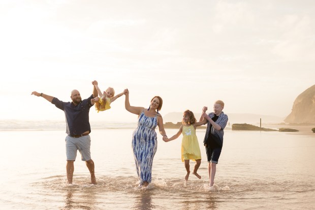 Family running on beach sedgefield beach photoshoot