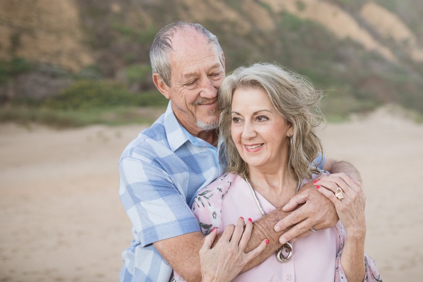 couple kissing sunset family photo session at Myoli Beach Sedgefield photo