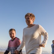 mother and son playing laughing running family beach session at Myoli beach Sedgefield