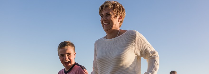 mother and son playing laughing running family beach session at Myoli beach Sedgefield