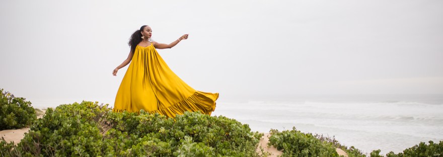 fashion model posing on myoli beach sedgefield during a sunset photoshoot by photographer moira du toit