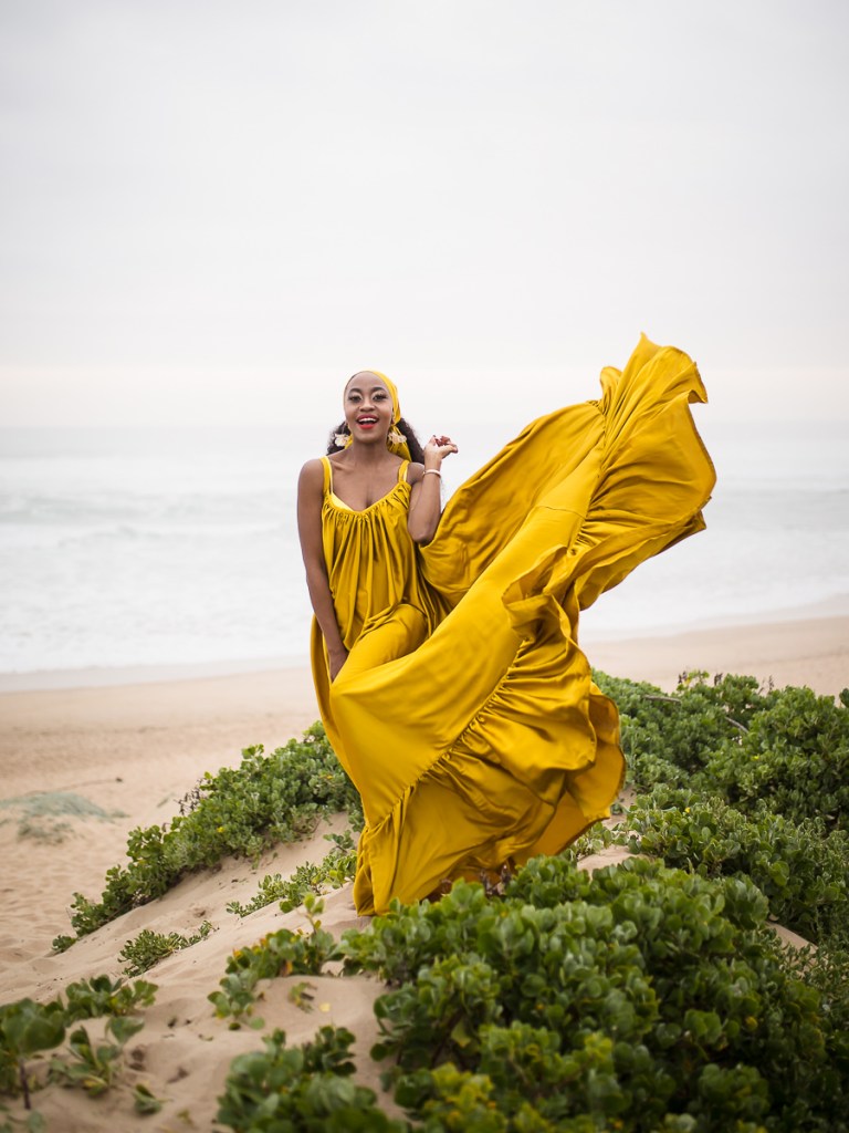 fashion model posing on myoli beach sedgefield during a sunset photoshoot by photographer moira du toit