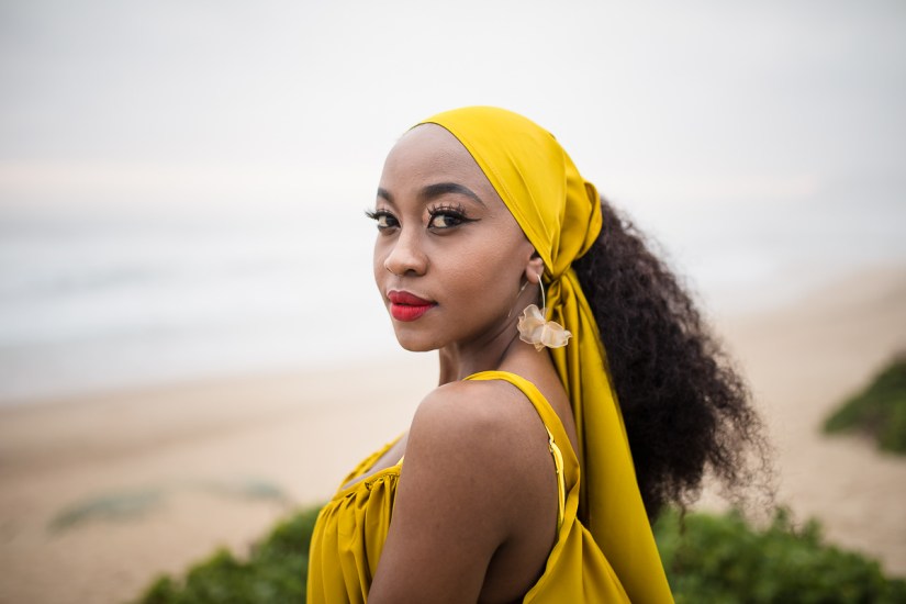 fashion model posing on myoli beach sedgefield during a sunset photoshoot by photographer moira du toit