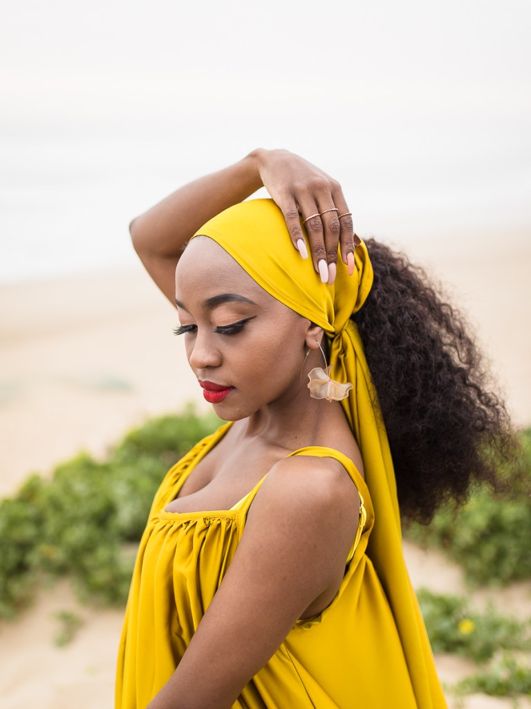 fashion model posing on myoli beach sedgefield during a sunset photoshoot by photographer moira du toit