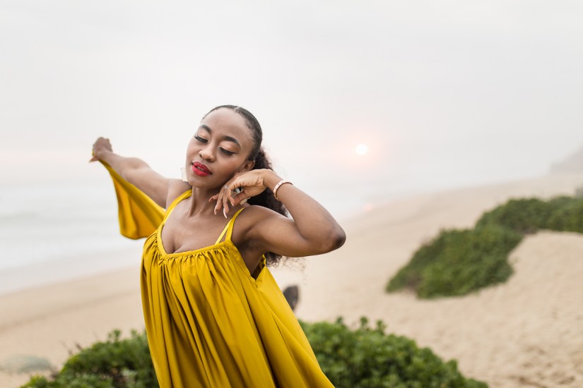 fashion model posing on myoli beach sedgefield during a sunset photoshoot by photographer moira du toit