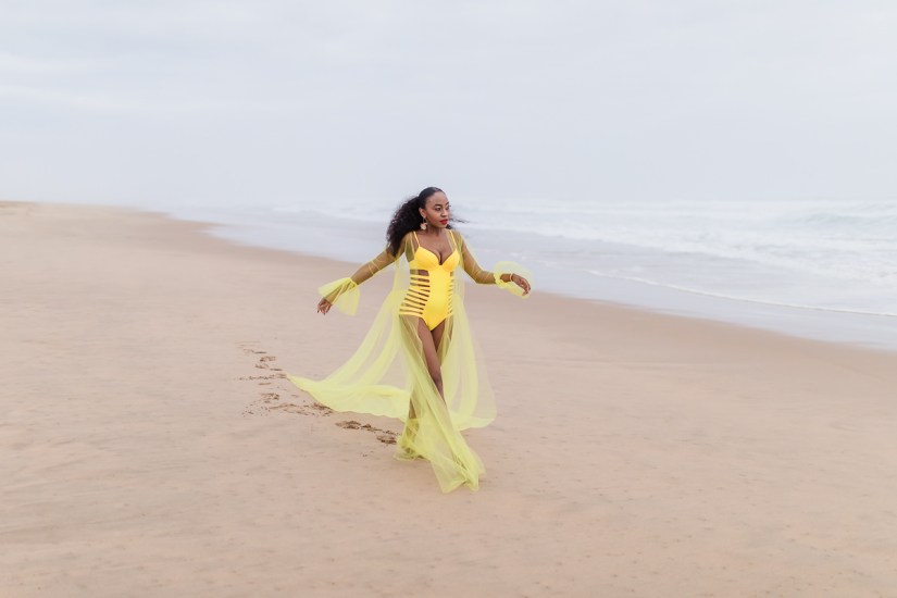 fashion model posing on myoli beach sedgefield during a sunset photoshoot by photographer moira du toit