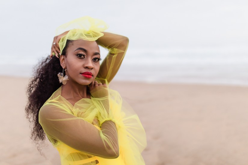 fashion model posing on myoli beach sedgefield during a sunset photoshoot by photographer moira du toit